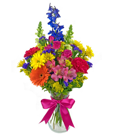 Bright, colorful blooms in a clear glass vase, available in 3 sizes.