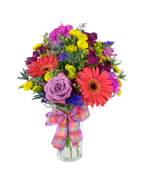 Bright and colorful flowers are arranged in a cylinder vase. 