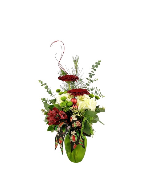 Green vase with red white and green flowers.