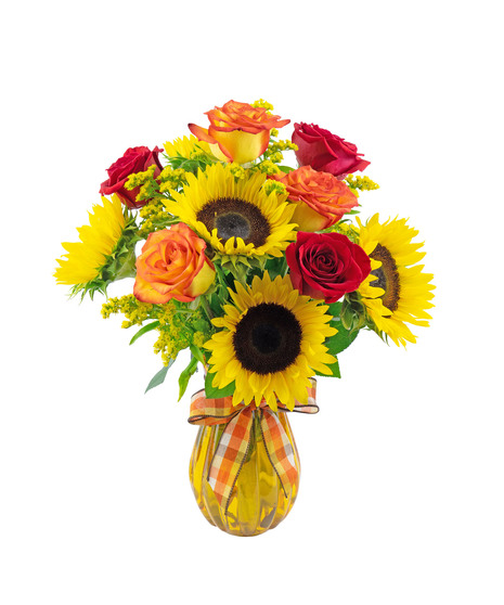 Classic and beautiful, half dozen roses with sunflowers in a colored glass vase.