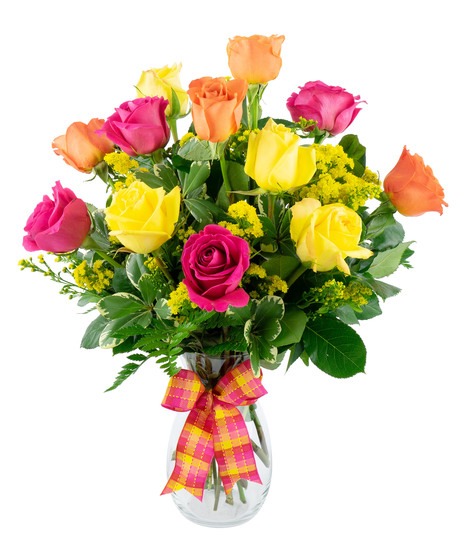 Gorgeous and brightly colored roses arranged in a clear glass garden vase, simply gorgeous.