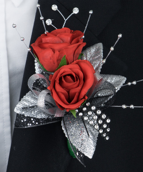Red spray roses with black and silver accents in fresh or silk flowers. 