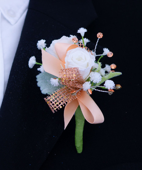 White spray roses with peach and rose gold accents in fresh or silk flowers. 