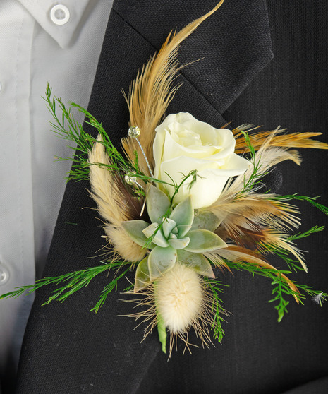 Corsage made with  a fresh succulent, spray rose and more. 