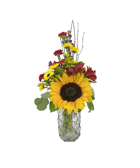 sunflowers and wildflowers in a glass wire wrapped vase