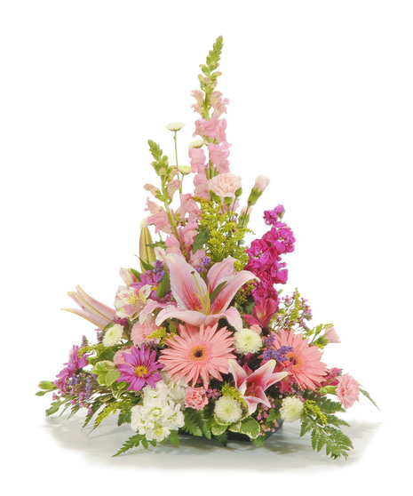 Sympathy arrangement of mini carnations, gerbera daisies, alstroemeria and more. 